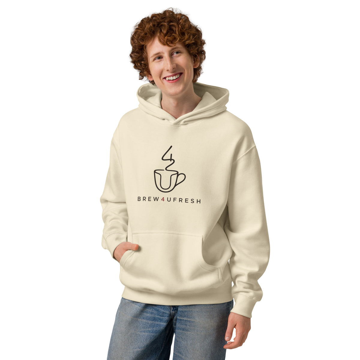 Cream-colored hoodie featuring a simple coffee cup graphic and BREW4UFRESH text, worn comfortably by a smiling model.