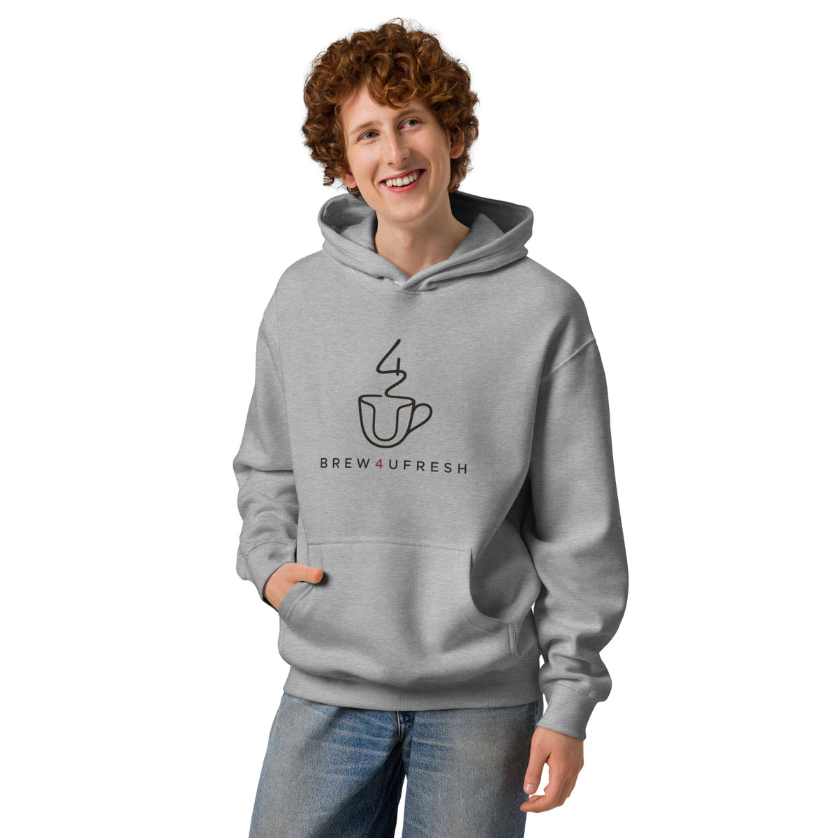 Light gray hoodie featuring a simple graphic of a cup and steam, worn by a smiling model with curly hair.