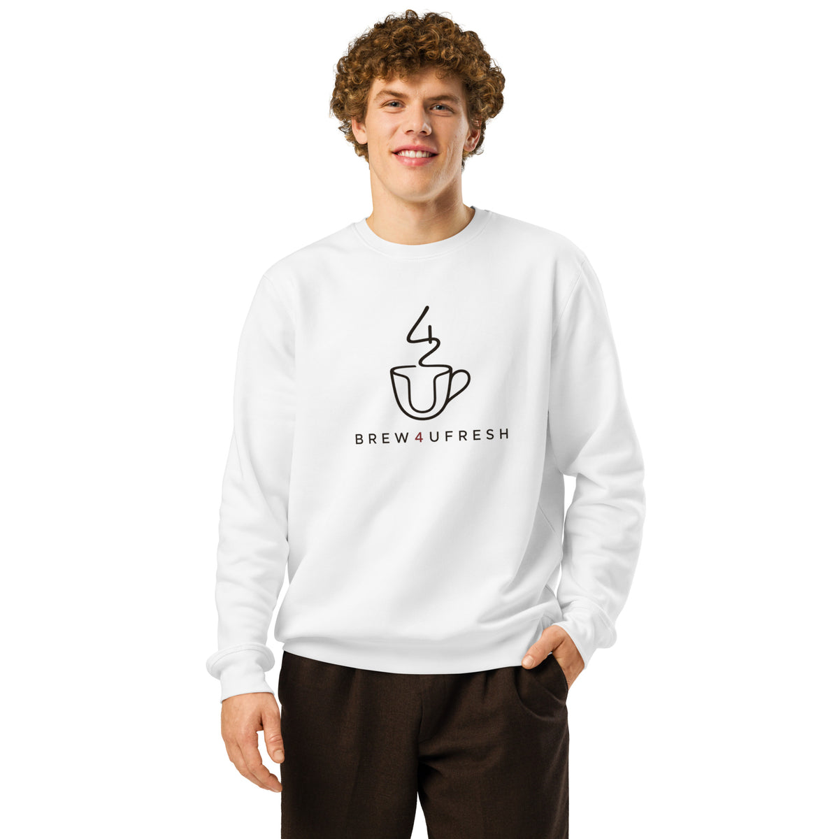 White sweatshirt featuring a black line drawing of a coffee cup and the text BREW4UFRESH. The model stands smiling, hands in pockets.